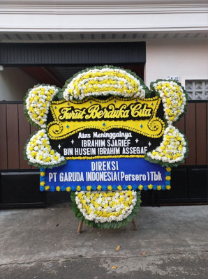 Papan Bunga Duka di Tomolito