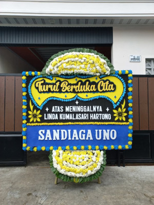Papan Bunga Duka di Tomolito