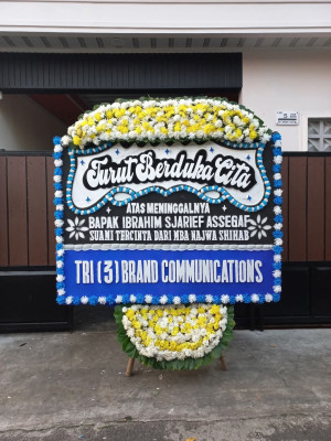 Papan Bunga Duka di Tomolito